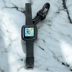 Fitbit Versa Black Smartwatch with Black band and charger